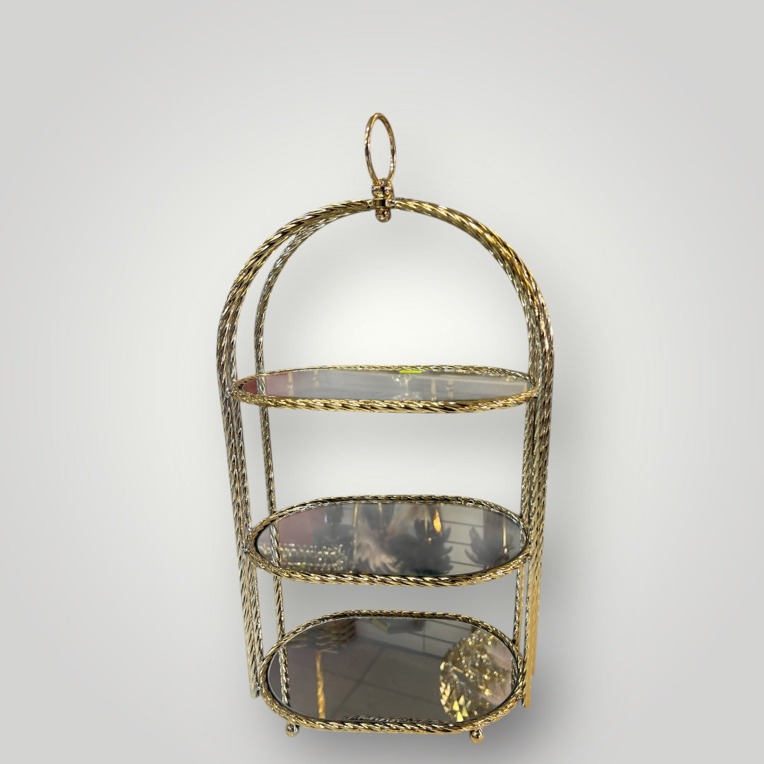 Estantería decorativa cilíndrica dorada con espejo interior