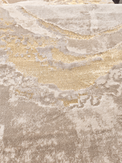 Áurea Beige / Dorado: detalle de la textura con iluminación retocada digitalmente.