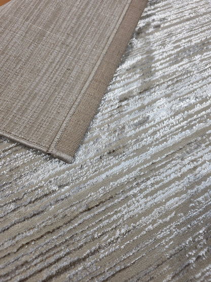 Alfombra Bruma: fotografía real del reverso y del borde rematado