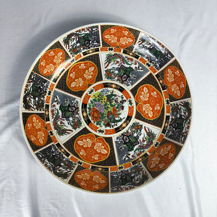 Prato fundo em cerâmica Tauss, decorado, 40,64 cm (16") – Desenho oriental clássico em tons de laranja e preto.